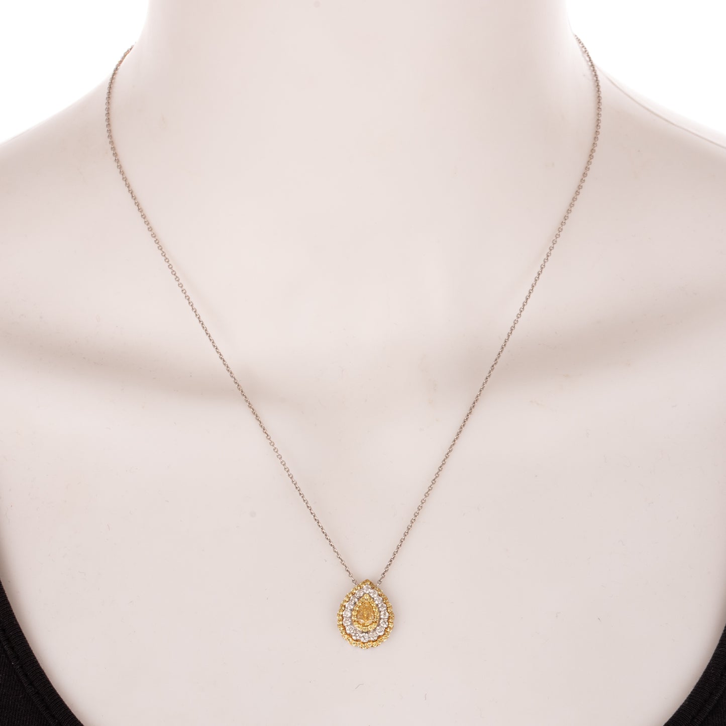 A Pear Shaped Yellow Diamond Halo Necklace in 18K